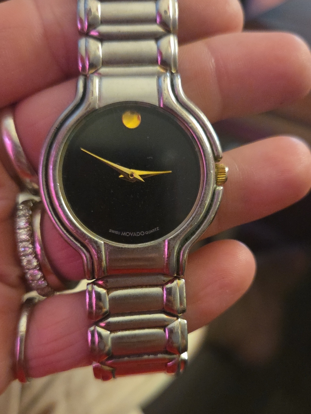 Movado Black Dial Watch with Gold Hands and Dot